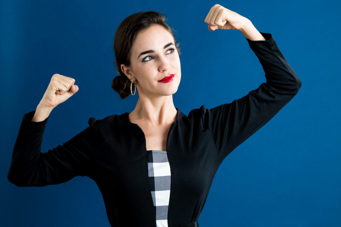 graphicstock-powerful-young-woman-on-a-dark-blue-background_SDaCcB3VdZ-scaled-1152x768 (1)