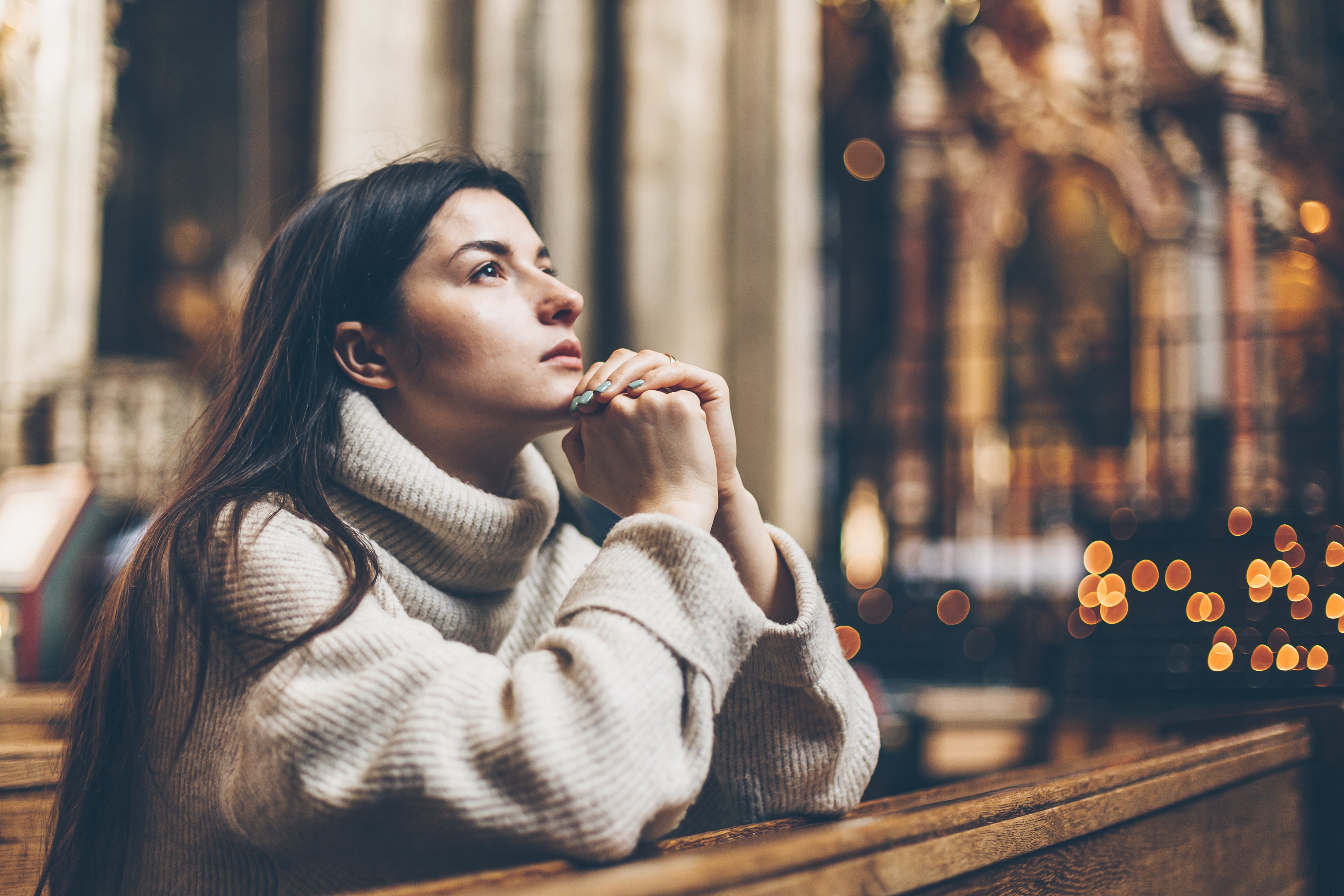 woman praying in church
