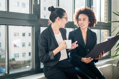 two women talking in the office